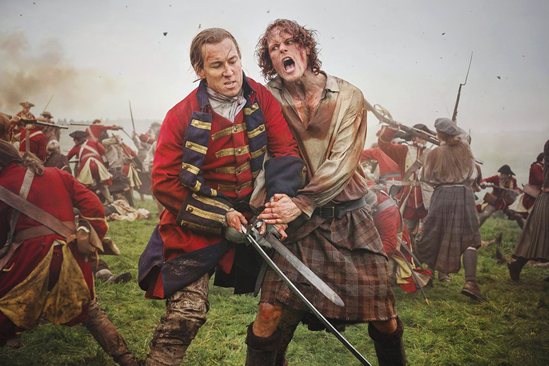 A photo of Sam Heughan and Tobias Menzies in a battle scene from season 3 of Outlander, taken by unit stills photographer, Aimee Spinks