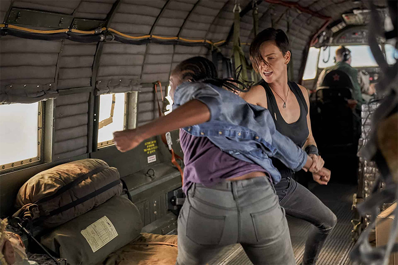 Kiki Layne and Charlize Theron battling it out on set of The Old Guard. Image taken by unit still photographer, Aimee Spinks